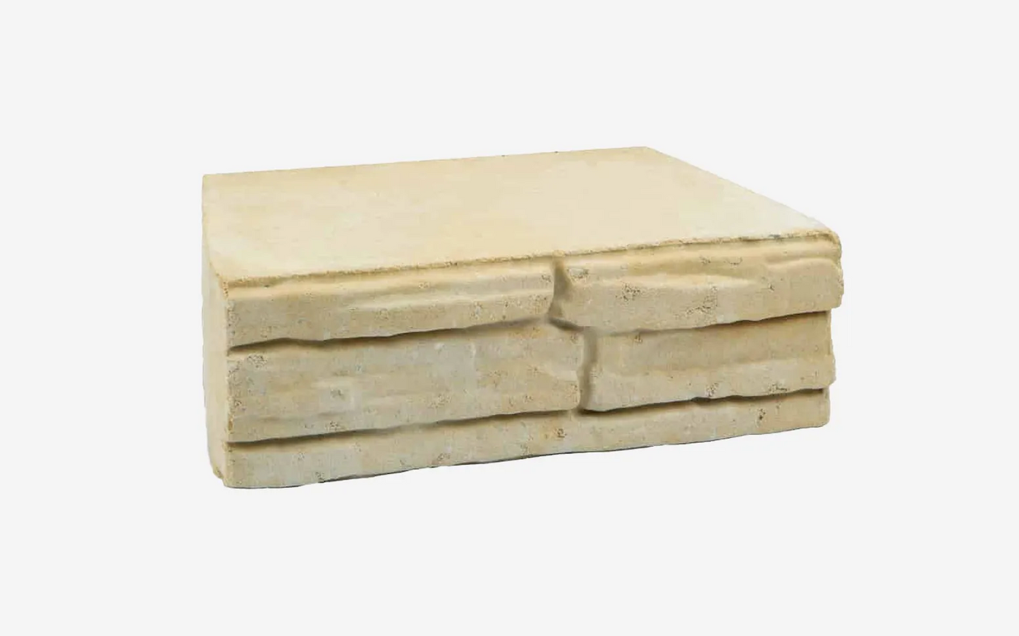 Stack of beige stone slabs on a white background