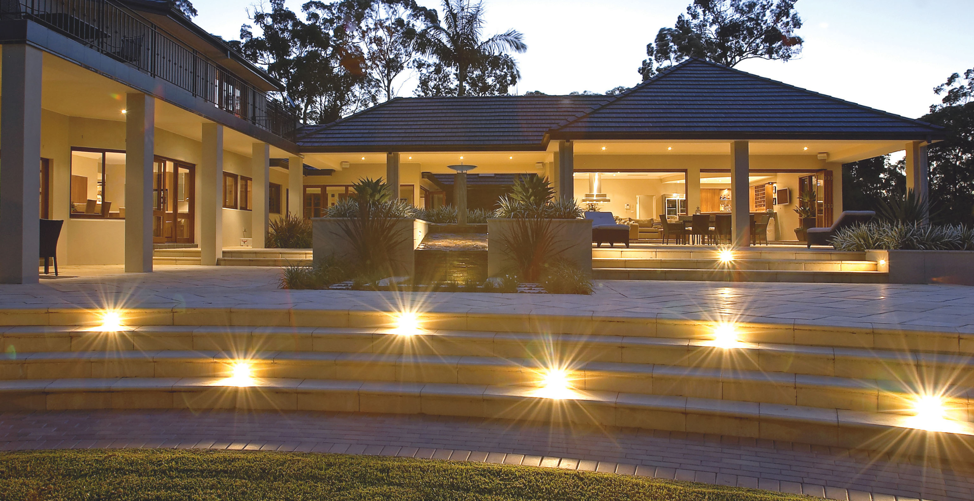 Evening view of a modern house with outdoor lighting