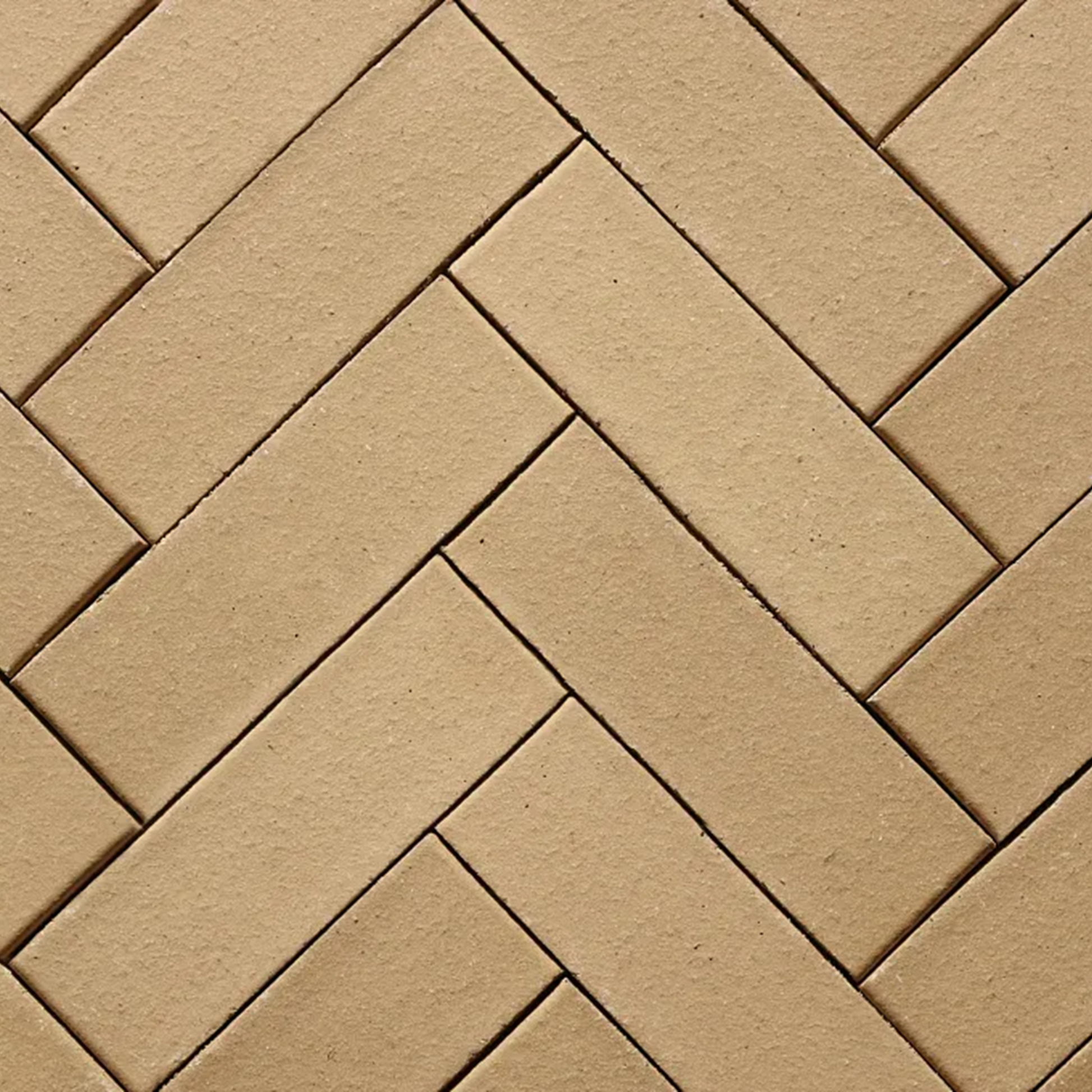 Pattern of beige bricks arranged in a herringbone design
