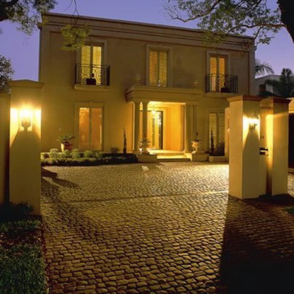 Luxurious house with illuminated entrance at night