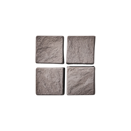 Four square cobblestone tiles on a white background