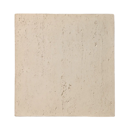 Beige stone tile with a textured surface on a white background