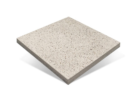 Square concrete tile with speckled pattern on a white background