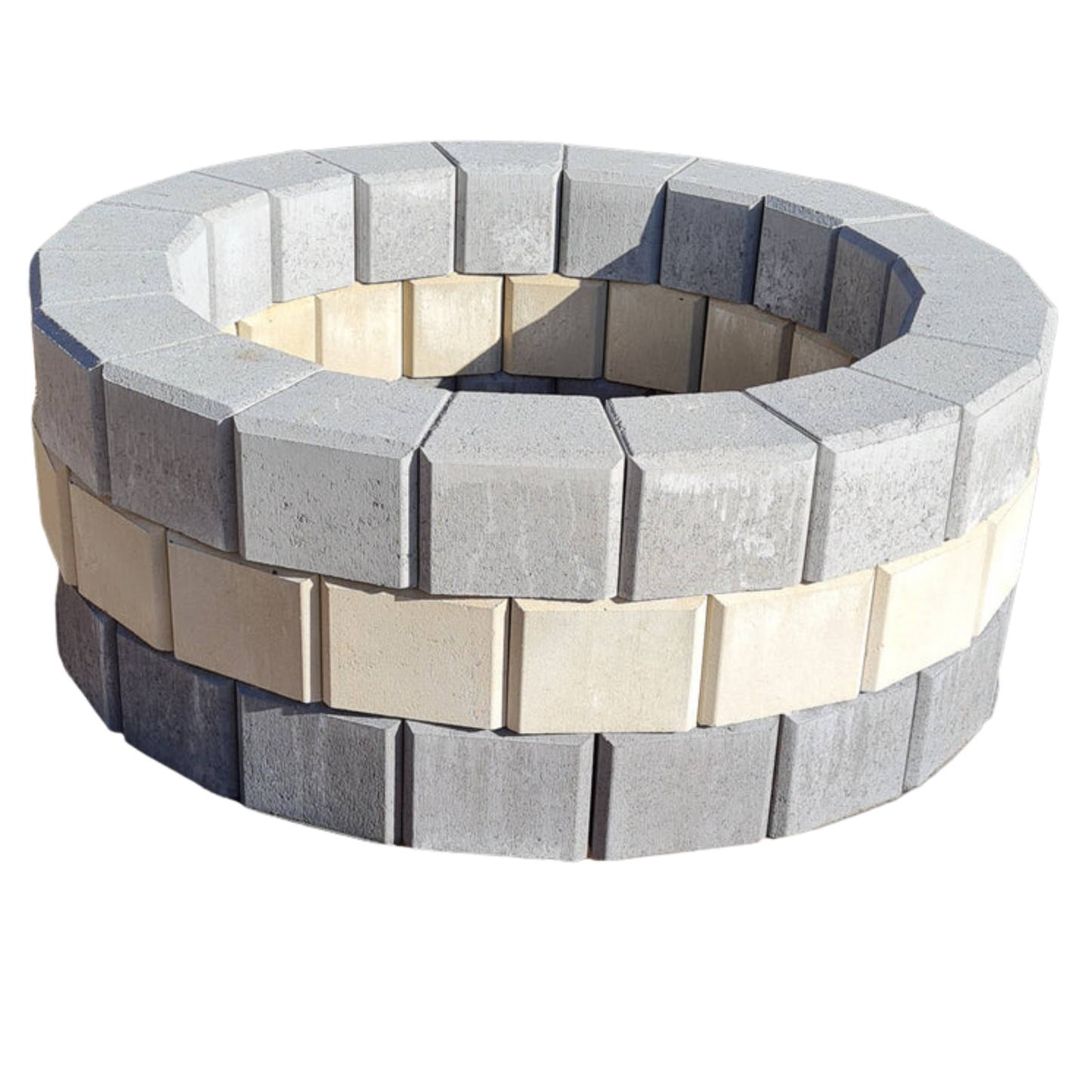 Round stone fire pit with alternating gray and beige stones on a white background