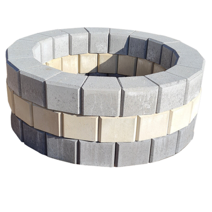 Round stone fire pit with alternating gray and beige stones on a white background